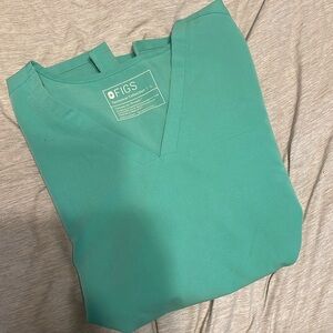 Size large Figs scrub top two pocket very good used condition